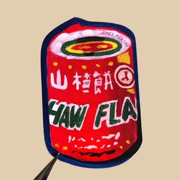 This sticker depicts a painting of the chinese candy haw flakes. Its iconic red wrapper is painted in a painterly style. There is a blue background on the sticker.