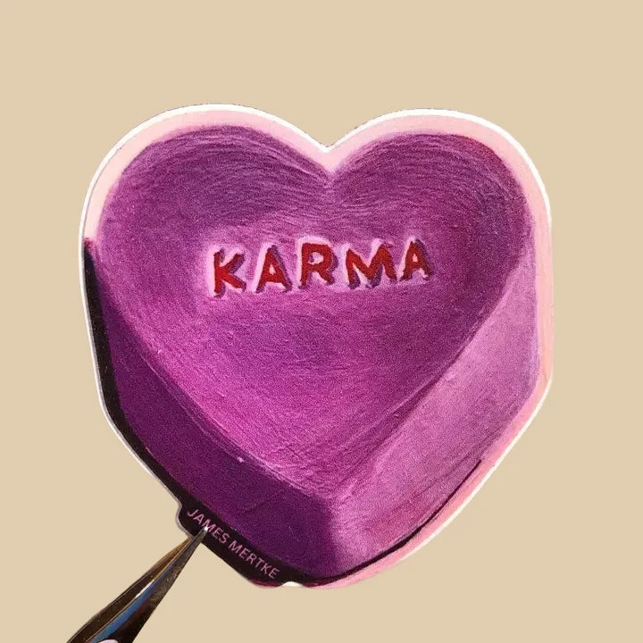 This sticker features a painting of a purple candy conversation heart with the word "KARMA" written on the front.