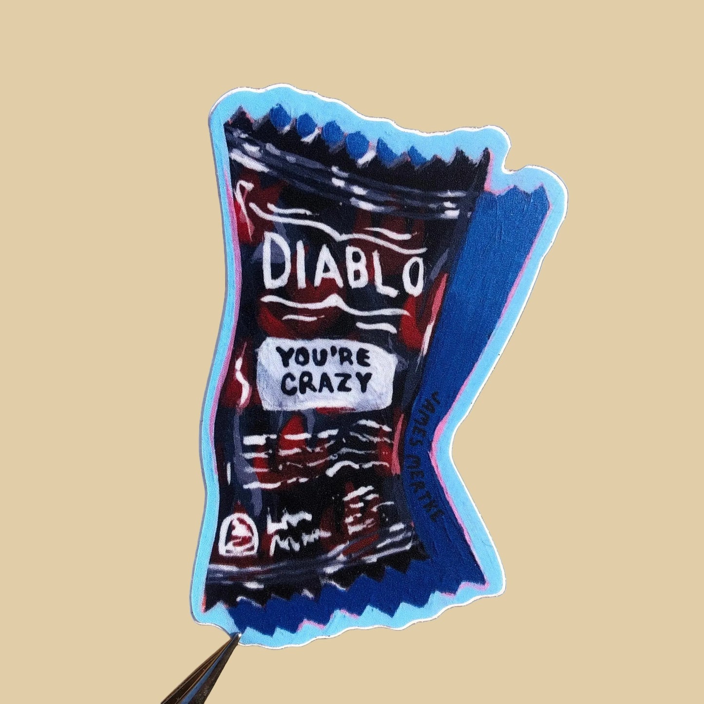 A sticker designed to resemble a packet of Taco Bell Diablo hot sauce with the text 'DIABLO' and 'YOU'RE CRAZY' on it, predominantly in red and blue colors.