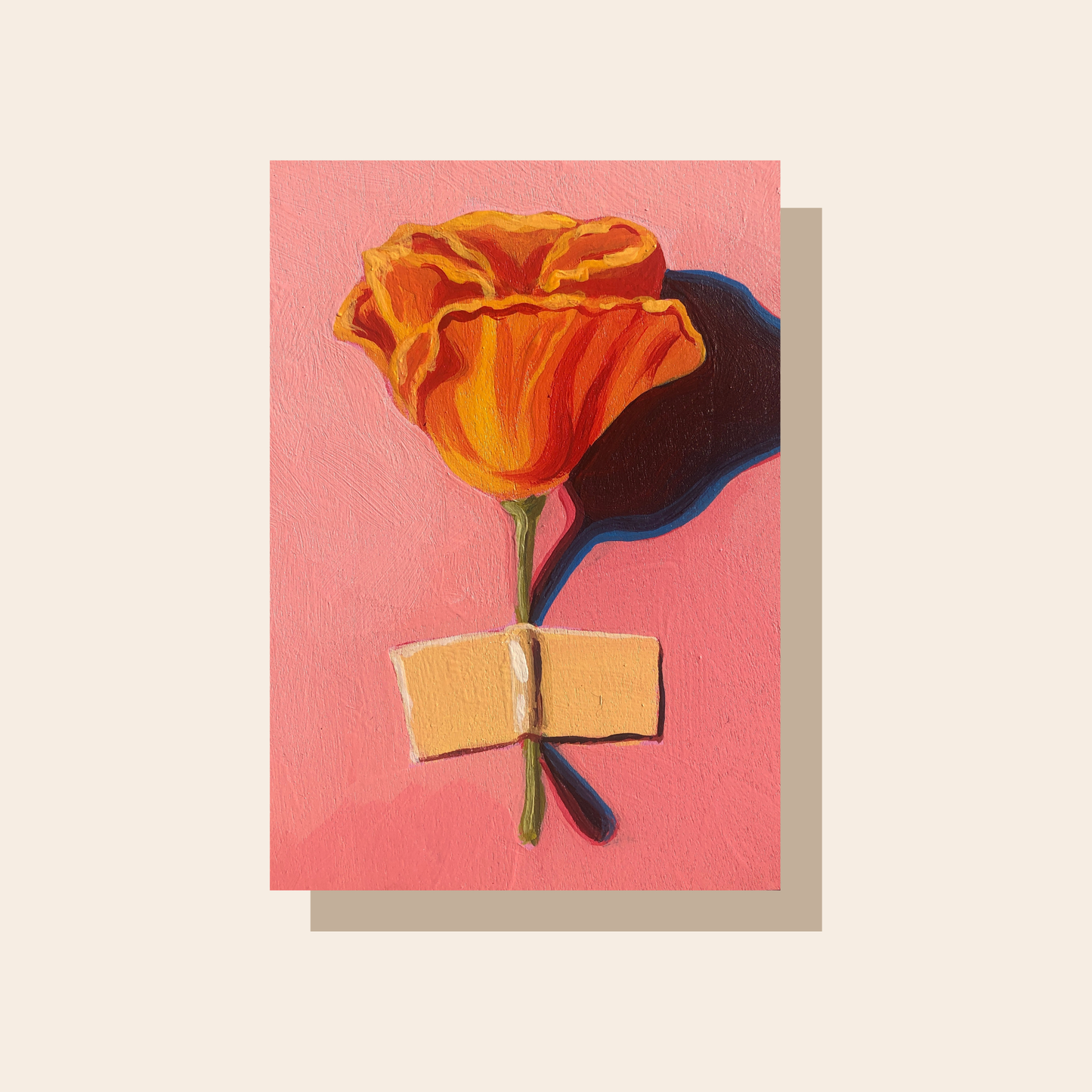 This art print features an orange California poppy taped to a pink wall with a piece of yellow masking tape.