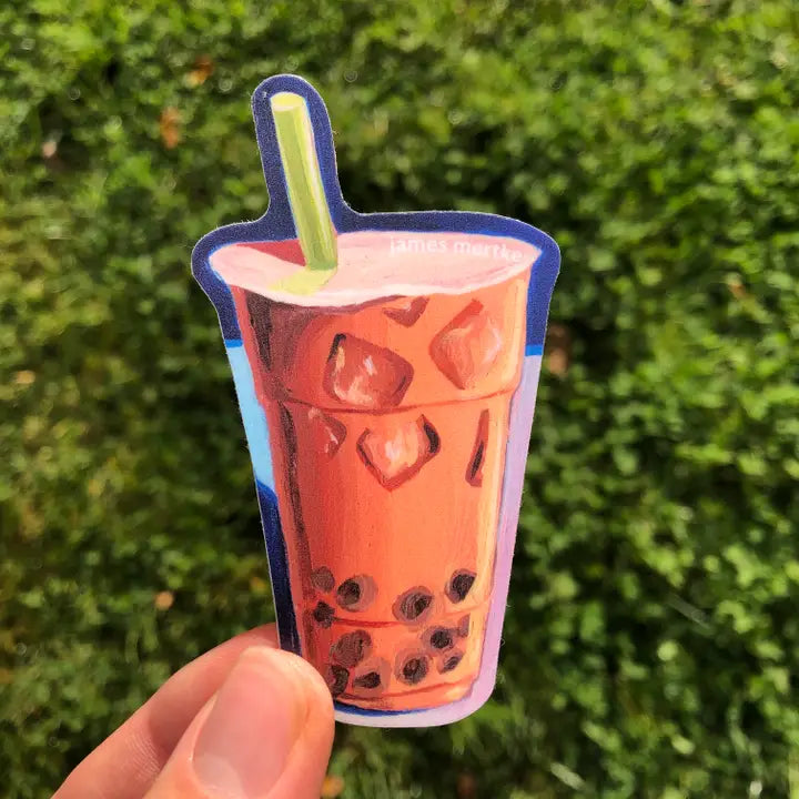 This sticker features a painting of an iced boba milk tea that's orange in color with a green straw.