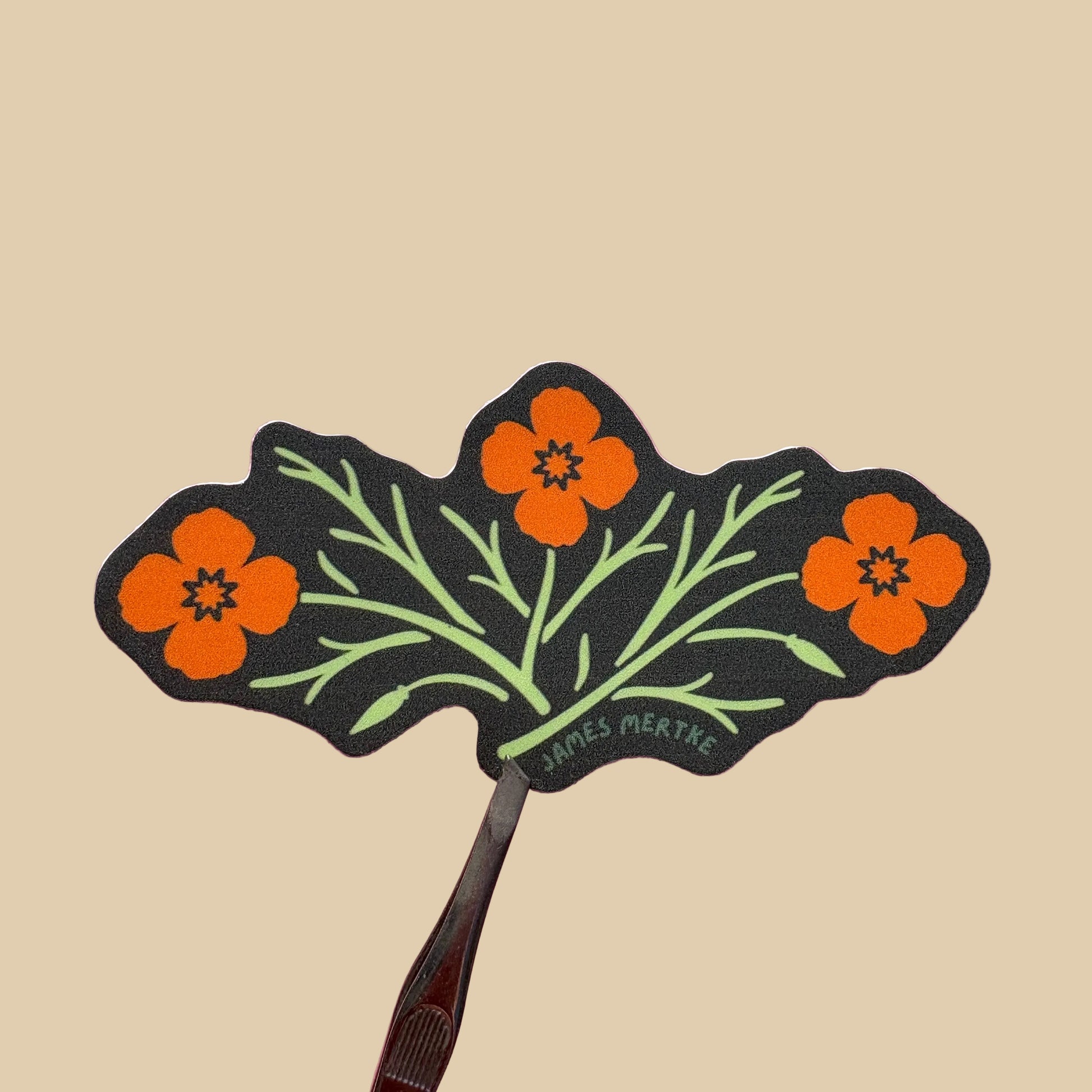 A die-cut sticker featuring three orange poppy flowers with light green stems on a dark green background.