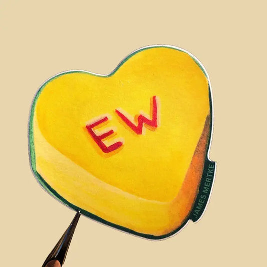 This sticker features a painting of a yellow conversation heart candy with "EW" written in red on the front.