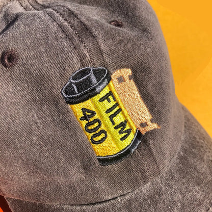 A close up of the embroidered film canister design.