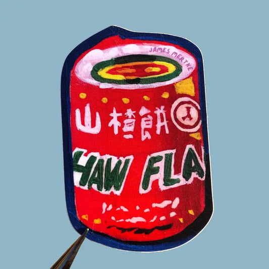 This sticker depicts a painting of the chinese candy haw flakes. Its iconic red wrapper is painted in a painterly style. There is a blue background on the sticker.