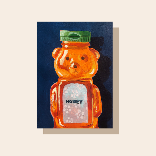 The art print features an orange honey bear bottle full of honey in front of a dark blue background.