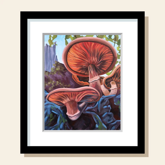 This painting art print features orange mushrooms growing out of the side of blue rocks. More of the forest nature scene can be seen in the background.