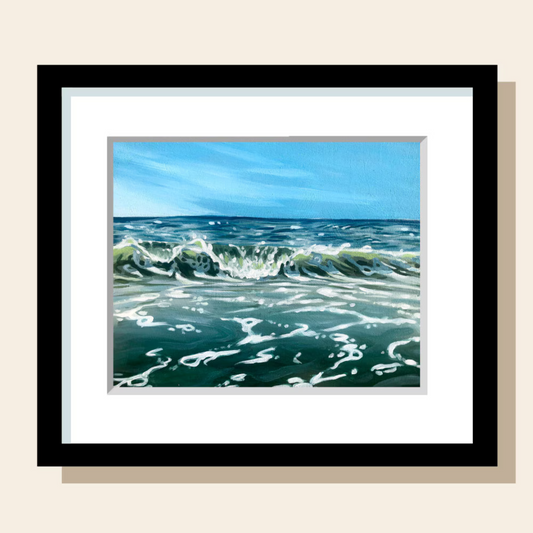 This art print features a crashing wave in the middle of a blue ocean. 