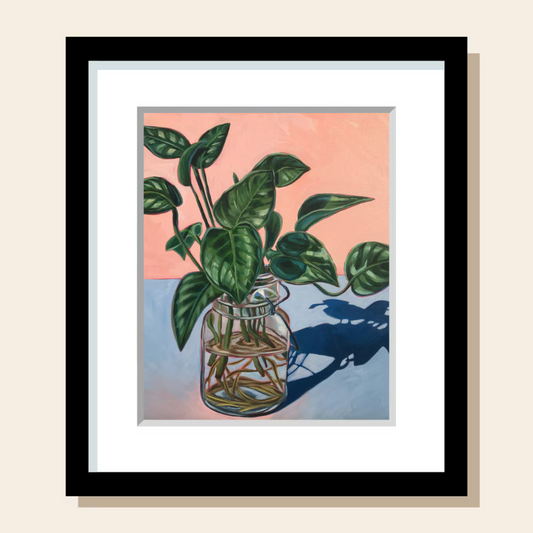 This painting art print depicts a bunch of leafy cuttings in a glass jar of water. They are being propagated, and new roots can be seen Gowing out of the stems. The surface it sits on is blue and the wall behind it is an orangey-pink.