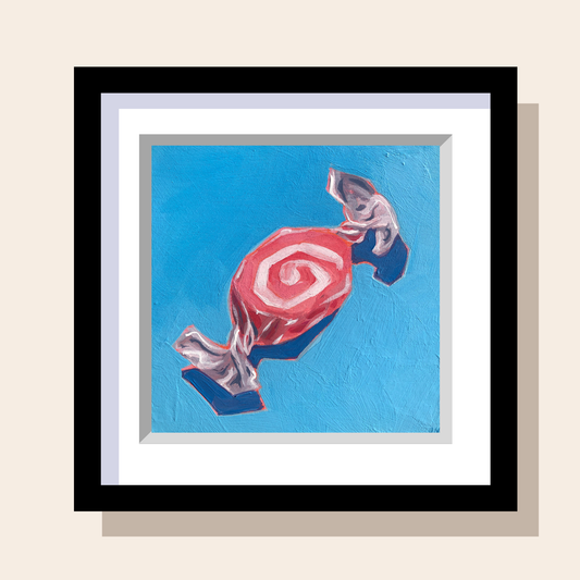 Artwork of a pink and white swirl saltwater taffy candy on a blue background.