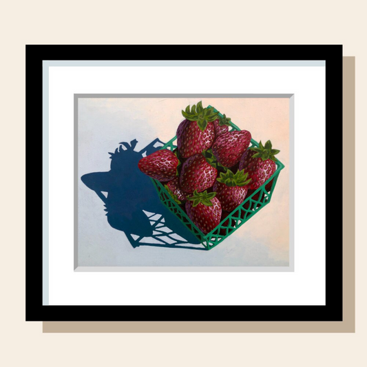 This painting art print features a green basket full of strawberries casting a dramatic shadow.