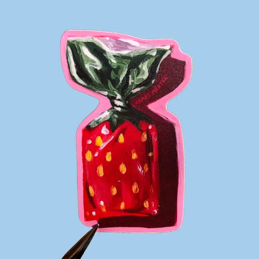 This sticker depicts a strawberry bonbon candy with a red and green wrapper and pink outline.