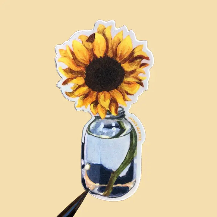 This sticker depicts a painting of a sunflower in a simple blue glass jar.