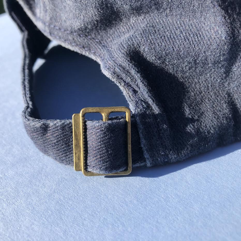 A close up of the adjustable buck on the back of the had to make it size adjustable. 